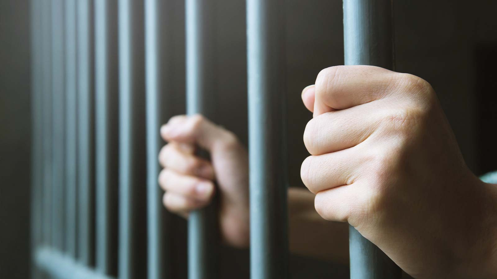 Jail bars, representing penalties for illegal dumping