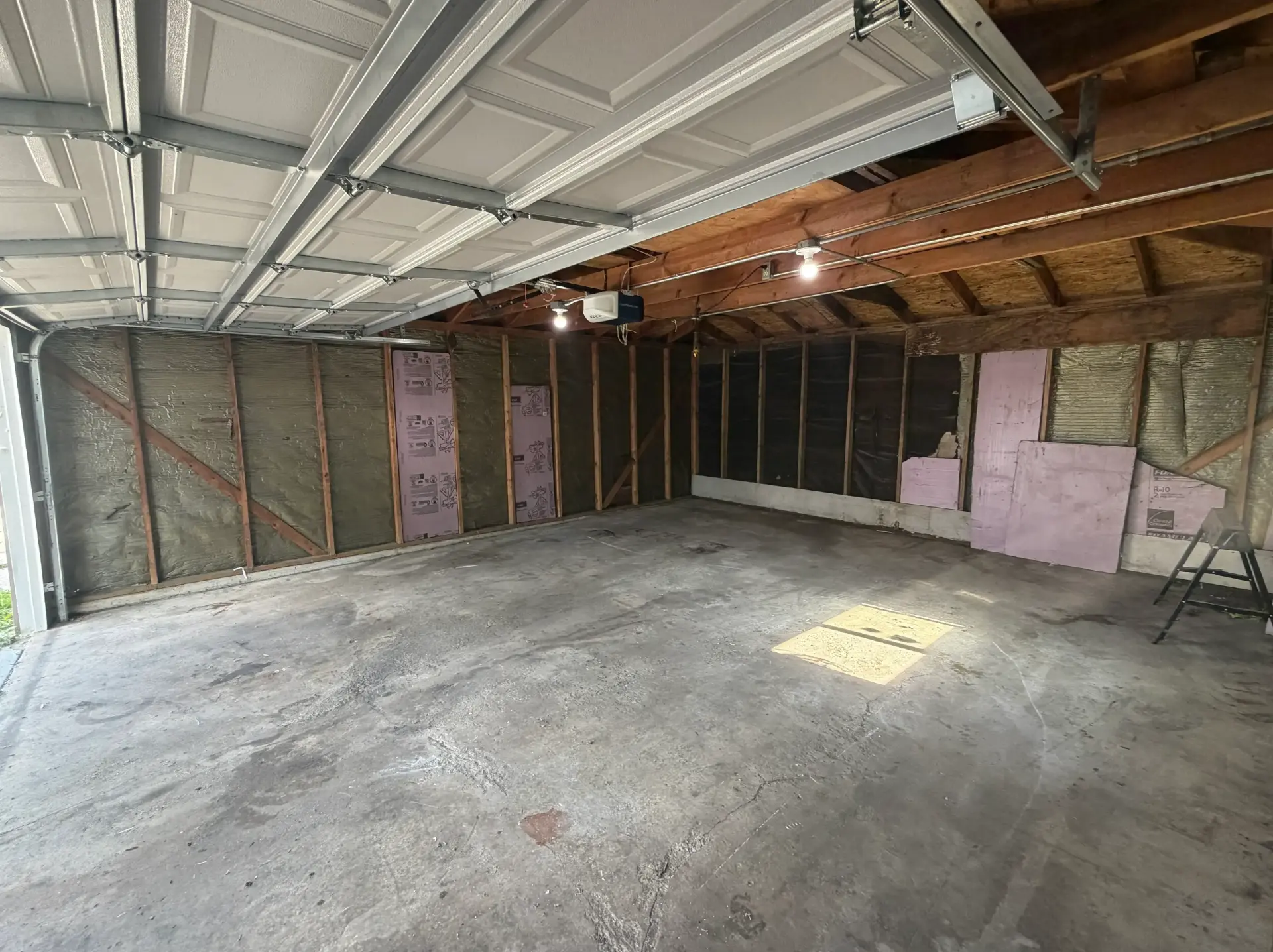 The same garage completely cleared and swept after construction debris removal