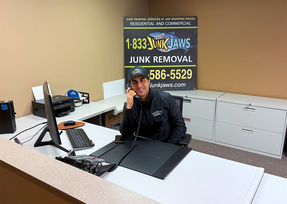 Joe answers the office phone.