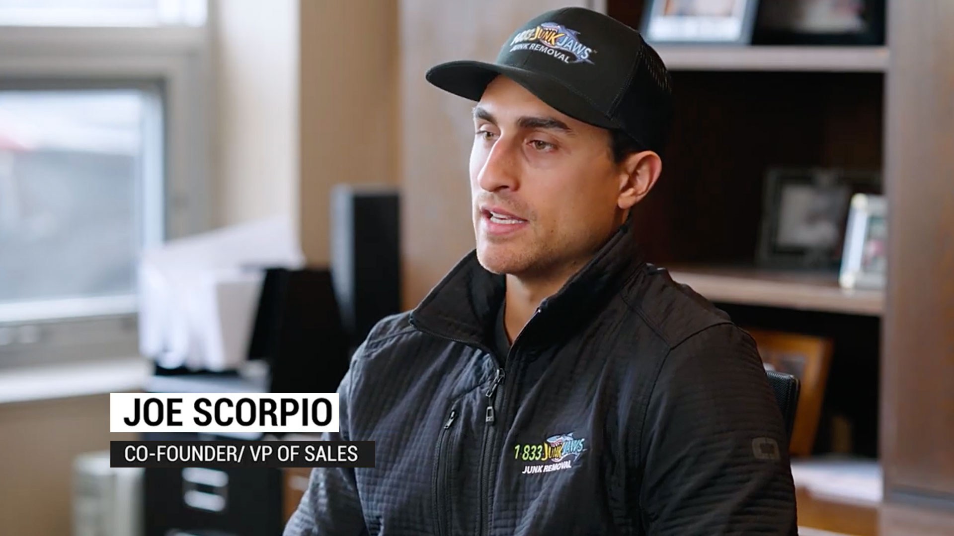 Joe Scorpio is speaking to a camera.