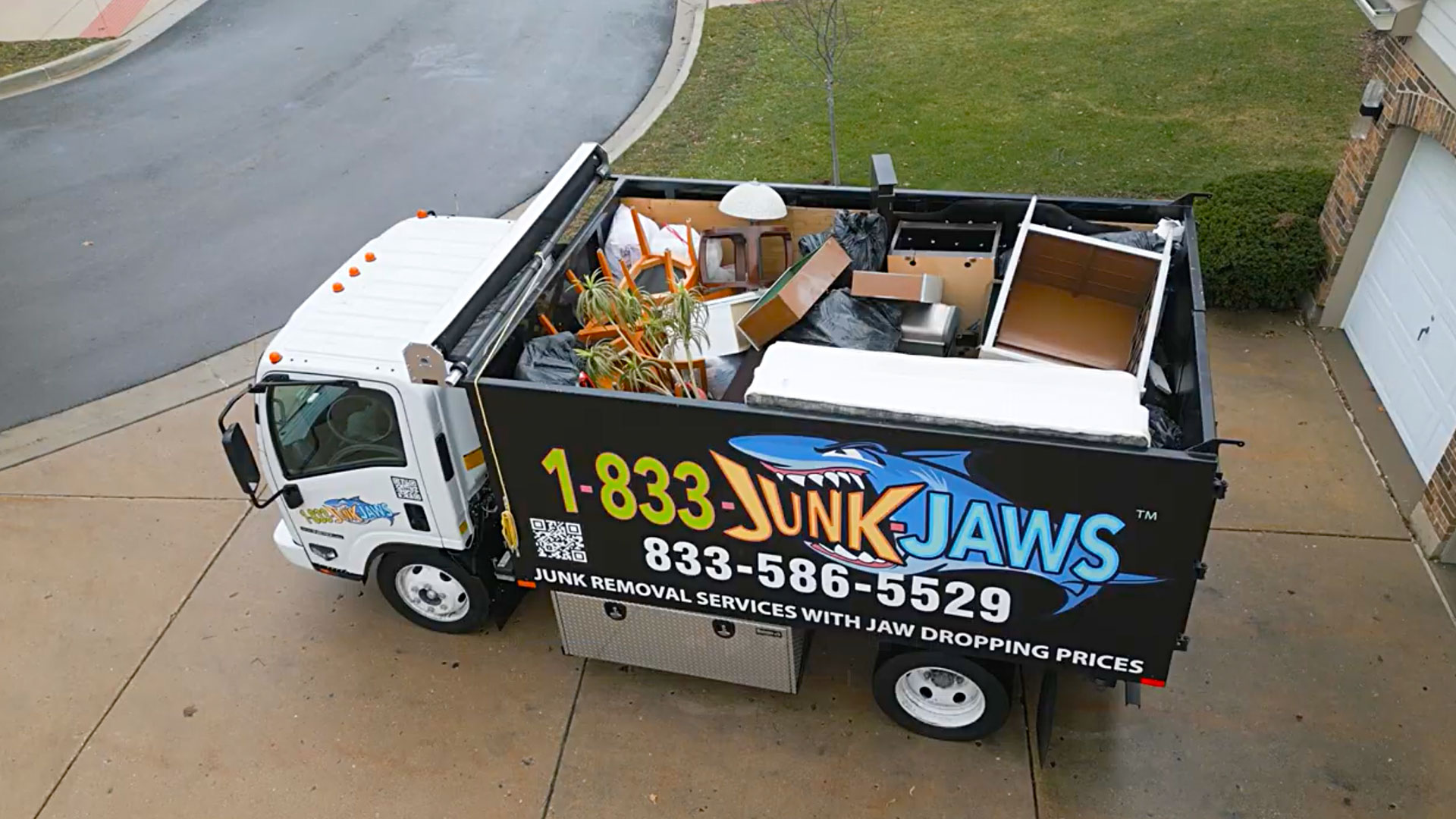 A fully loaded Junk Jaws truck after a commercial cleanout.