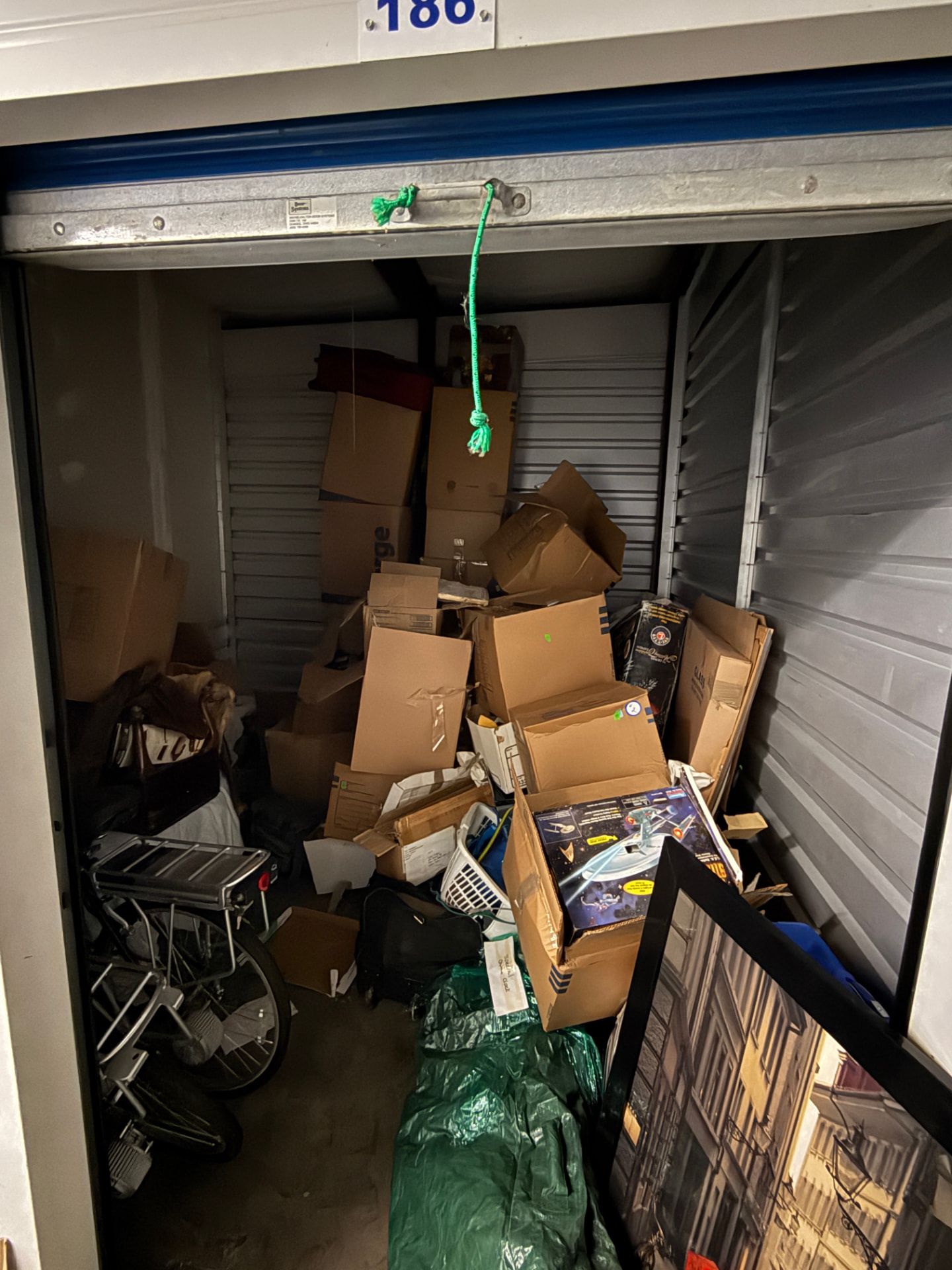 Junk Jaws employees clean out a storage unit.